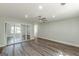 This bedroom features a ceiling fan, wood-look flooring, and a mirrored closet at 1446 Westmont Sw Rd, Atlanta, GA 30311