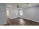 This light-blue bedroom features wood-look floors, recessed lights, and natural light through windows at 1446 Westmont Sw Rd, Atlanta, GA 30311