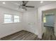 This bedroom offers neutral paint, great natural light, wood-look flooring, and a closet at 1446 Westmont Sw Rd, Atlanta, GA 30311