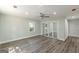 This bedroom features a ceiling fan, wood-look flooring, and a mirrored closet at 1446 Westmont Sw Rd, Atlanta, GA 30311