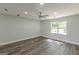 This bedroom offers great natural light, ceiling fan, and wood-look flooring at 1446 Westmont Sw Rd, Atlanta, GA 30311