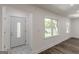 Bright home entrance with decorative glass front door and marble tile at 1446 Westmont Sw Rd, Atlanta, GA 30311