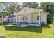 Beautifully maintained home with a welcoming front porch and pristine landscaping at 1446 Westmont Sw Rd, Atlanta, GA 30311