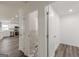 Hallway view to the new bathroom and modern kitchen with stainless appliances at 1446 Westmont Sw Rd, Atlanta, GA 30311