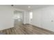 Hallway featuring new floors, doors, recessed lighting, and access to the bathroom at 1446 Westmont Sw Rd, Atlanta, GA 30311