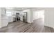 Modern kitchen featuring stainless steel appliances, white cabinets, and hardwood floors at 1446 Westmont Sw Rd, Atlanta, GA 30311