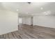 Large, bright living room featuring hardwood floors, recessed lighting, and access to other rooms at 1446 Westmont Sw Rd, Atlanta, GA 30311