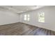 Well-lit living room with hardwood floors and updated double-pane windows at 1446 Westmont Sw Rd, Atlanta, GA 30311