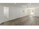 Spacious room with chandelier lighting, new floors, and a doorway to the bathroom at 1446 Westmont Sw Rd, Atlanta, GA 30311