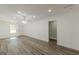 Bright living room with new floors, chandelier and view of the outdoor deck at 1446 Westmont Sw Rd, Atlanta, GA 30311