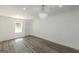 Large room features new floors, lighting, and an entryway to the deck at 1446 Westmont Sw Rd, Atlanta, GA 30311