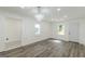 Cozy living room with new floors, a stylish chandelier, and access to a bathroom at 1446 Westmont Sw Rd, Atlanta, GA 30311