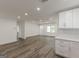 Bright living room features new floors, recessed lighting, and fresh white paint at 1446 Westmont Sw Rd, Atlanta, GA 30311