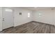 Bright room with a white door, wood floors, and white walls at 1446 Westmont Sw Rd, Atlanta, GA 30311