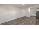 This open concept living room features wood-look floors and is open to the kitchen with new stainless appliances at 1446 Westmont Sw Rd, Atlanta, GA 30311