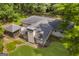 Aerial view of the home with a screened-in gazebo and lush green yard at 2164 Old Rex Morrow Rd, Morrow, GA 30260