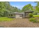 This home features an outdoor patio and screened-in gazebo in a wooded backyard at 2164 Old Rex Morrow Rd, Morrow, GA 30260