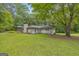 Spacious backyard featuring a screened-in gazebo and mature trees at 2164 Old Rex Morrow Rd, Morrow, GA 30260