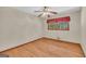 Bedroom with hardwood floors, natural light, and red valance at 2164 Old Rex Morrow Rd, Morrow, GA 30260