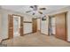 This bedroom has carpeting, ceiling fan, closet, and access to an ensuite bathroom with tile shower at 2164 Old Rex Morrow Rd, Morrow, GA 30260