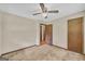 Bedroom featuring neutral walls, plush carpeting, and a ceiling fan for comfort at 2164 Old Rex Morrow Rd, Morrow, GA 30260