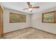 Spacious bedroom with two windows offering backyard views and ceiling fan at 2164 Old Rex Morrow Rd, Morrow, GA 30260