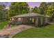 Quaint brick home featuring a convenient carport and well-manicured lawn for comfortable suburban living at 2164 Old Rex Morrow Rd, Morrow, GA 30260