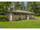 Charming one-story brick home with a well-manicured lawn and inviting front porch at 2164 Old Rex Morrow Rd, Morrow, GA 30260