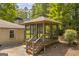 This property features a gazebo screened-in for pest protection and an enjoyable outdoor space at 2164 Old Rex Morrow Rd, Morrow, GA 30260