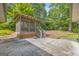 The exterior of this home features a screened-in gazebo and a concrete patio at 2164 Old Rex Morrow Rd, Morrow, GA 30260