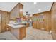 Functional kitchen featuring wood cabinets, modern appliances, and convenient breakfast bar at 2164 Old Rex Morrow Rd, Morrow, GA 30260