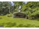 Well maintained lawn featuring a steel storage shed with a small amount of material stored inside at 2164 Old Rex Morrow Rd, Morrow, GA 30260