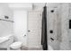 Modern bathroom features marble-style tile, a shower-tub combo, and white fixtures at 3859 N Camp Creek Sw Pkwy, Atlanta, GA 30331