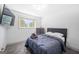 Cozy bedroom featuring a comfortable bed, soft carpet, a TV and natural light from the window at 3859 N Camp Creek Sw Pkwy, Atlanta, GA 30331