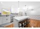 Beautiful kitchen with quartz countertops, herringbone backsplash, stainless steel appliances, and stylish pendant lighting at 3859 N Camp Creek Sw Pkwy, Atlanta, GA 30331