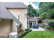 View of backyard with covered patio and grill, perfect for outdoor cooking at 148 Lakeside Dr, Peachtree City, GA 30269