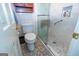 Bathroom featuring walk-in shower with a built-in seat, grab bar, and tiled niche at 148 Lakeside Dr, Peachtree City, GA 30269