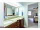 Bathroom features double vanity with granite countertop and large mirror at 148 Lakeside Dr, Peachtree City, GA 30269
