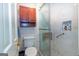 Bathroom featuring walk-in shower with a built-in seat, grab bar, and tiled niche at 148 Lakeside Dr, Peachtree City, GA 30269