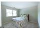 Cozy bedroom with a queen-sized bed and a window offering natural light at 148 Lakeside Dr, Peachtree City, GA 30269