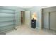 Bedroom featuring neutral walls, carpet, shelving units and closet space at 148 Lakeside Dr, Peachtree City, GA 30269