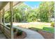 Beautiful landscaping with a meandering walkway, a grassy lawn, and trees in this home's front yard at 148 Lakeside Dr, Peachtree City, GA 30269