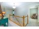 Hallway featuring wood railing leading to the upper level at 148 Lakeside Dr, Peachtree City, GA 30269