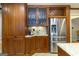 A kitchen features stainless steel appliances, wood cabinets, wine wrack and granite counters at 148 Lakeside Dr, Peachtree City, GA 30269