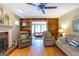 Inviting living room with hardwood floors, fireplace, and built-in shelving at 148 Lakeside Dr, Peachtree City, GA 30269