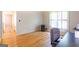 Functional office area with wood floors, ample natural light from bay window, and a workspace ready for productivity at 148 Lakeside Dr, Peachtree City, GA 30269