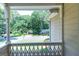 View from a cozy porch showcasing a lush, green landscape and surrounding neighborhood at 148 Lakeside Dr, Peachtree City, GA 30269