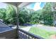 View from a porch overlooking a tree-lined neighborhood with houses at 148 Lakeside Dr, Peachtree City, GA 30269