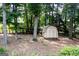 View of the home's backyard shed, providing ample storage space for gardening equipment and outdoor items at 148 Lakeside Dr, Peachtree City, GA 30269