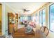 Bright sunroom with tile floors, ceiling fan, and view of outside at 148 Lakeside Dr, Peachtree City, GA 30269